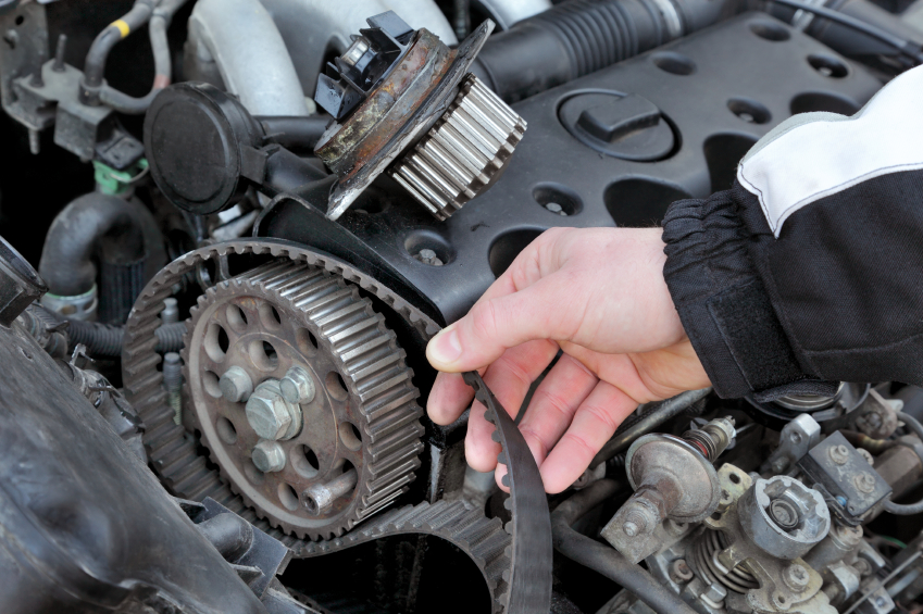 Engine bay with exposed belt assembly